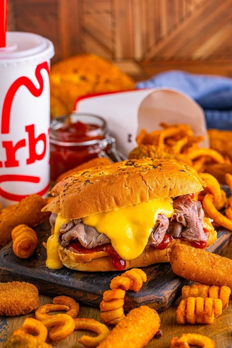 The iconic Arby's Beef and Cheddar sandwich - an irresistible combo of savory roast beef, tangy Arby's sauce, and luscious cheddar sauce, all piled high on a fluffy onion bun. Copycat Arbys Beef And Cheddar, Copycat Arbys, Beef And Cheddar Sandwich, No Bake Key Lime Pie Recipe, Stuffed Celery Sticks, Onion Bun, Arbys Beef And Cheddar, Key Lime Pie Recipe No Bake, Arby's Sauce