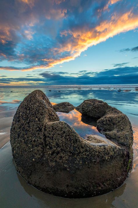 I photographed this unique reflection on Moeraki Boulders Beach on the South Island of New Zealand. The rainwater trapped in the boulder reflected the sky, and the ocean reflected the sky as well but ... Unreal Nature, Nz Scenery, Unreal Places, New Zealand Photography, Moeraki Boulders, Boulders Beach, New Zealand Beach, Boulder Beach, New Zealand Landscape