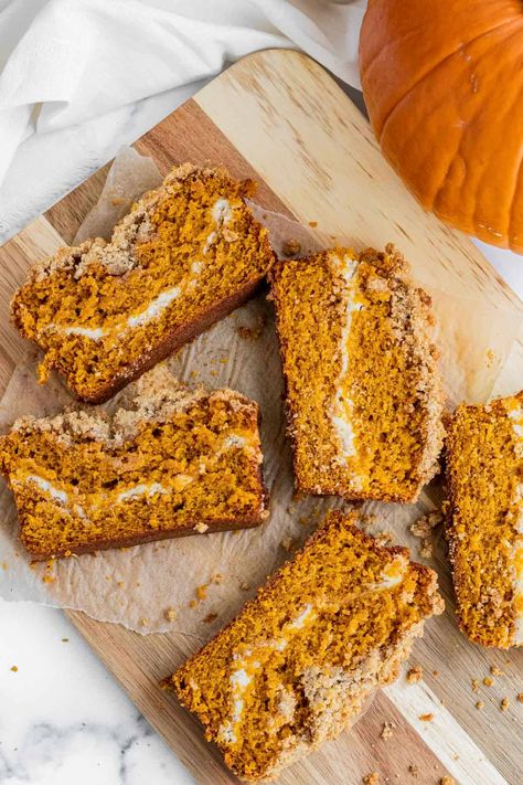 A delicious pumpkin spice bread batter is layered with smooth sweetened cream cheese. For some contrast of texture, the bread is topped with a crunchy brown sugar streusel. This quick bread is easy to make and doesn't even require a mixer if you don't have one! | themarblekitchen.com #pumpkinbread #brownsugar streusel #quickbread #fallbaking #fallbread Spiced Pumpkin Bread, Pumpkin Cream Cheese Bread, Pumpkin Spice Bread, Cream Cheese Bread, Spice Bread, Pumpkin Cream Cheese, Eat Cupcakes, Holiday Baking Recipes, Homemade Pumpkin Puree