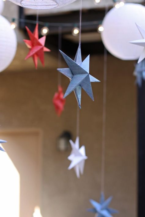 Easy DIY paper stars for the Fourth of July or any other holiday or party where you want simple and inexpensive hanging decorations. Hanging Stars Decorations, Stars Decorations, Hanging Origami, Diy Christmas Star, Paper Mache Christmas, Festive Recipes, Fourth Of July Decorations, Hanging Stars, Star Garland