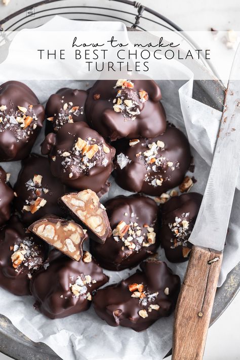 Learn how to make chocolate turtles from scratch. With a slow-cooked caramel, deeply toasted pecans, and a dip in perfectly tempered chocolate. Rich, gooey caramel, crunchy pecans and snappy chocolate. A thing of beauty! Follow me on Pinterest for more recipes like this! Dark Chocolate Turtles Recipe, Chocolate Turtles Recipe, Dark Chocolate Turtles, Turtles Recipe, Chocolate Covered Pecans, Turtle Recipe, Tempered Chocolate, Chocolate Turtle, Chocolate Decadence