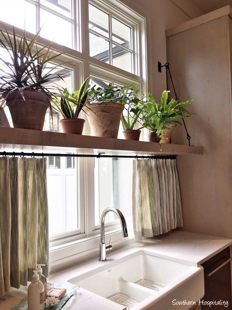 Window Ledge Ideas Kitchen, Kitchen Sink Off Center Of Window, Behind The Kitchen Sink Decor, Shelves In Front Of Windows Kitchen, Kitchen Window Shelf For Plants, Kitchen Sink And Window Ideas, Over Window Plant Shelf, Cute Kitchen Window Ideas, Kitchen Window Seal Ideas Decor