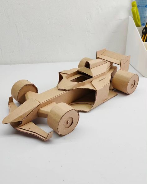 F1 car model made out of cardboard F1 Diy Ideas, Race Car Craft, Cardboard Cars, Paper Cars, Paper Objects, Cardboard Car, Paper Folding Crafts, Cardboard Model, Paper Car