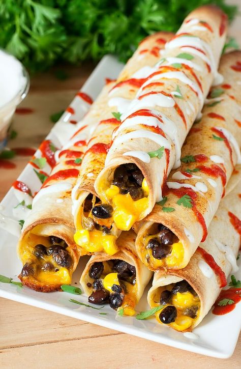 Cheesy Baked Black Bean Flautas Black Bean Flautas, Bean Flautas, Black Beans And Corn, Beans And Corn, Dip Sauce, Ranch Dip, Flour Tortillas, Game Day Food, Meatless Meals