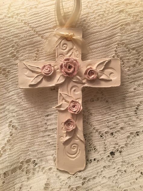 Handbuilt cross with pink roses for baby girl christening Glazed in Antique White and pink Ceramic Crosses Ideas, Christian Ceramic Ideas, Christian Clay Art, Easter Jesus Crafts, Polymer Clay Cross, Cross Ceramic, Hand Painted Crosses, Recuerdos Primera Comunion Ideas, Ceramic Bead Jewelry