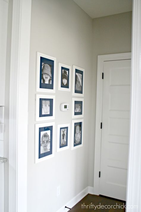 Art wall around the thermostat (and a hanging art hack) Thrifty Decor Chick, Wallpaper Project, Thrifty Decor, Bookcase Wall, How To Hang Wallpaper, How To Install Wallpaper, Small Hallways, Built In Bookcase, Leaf Garland