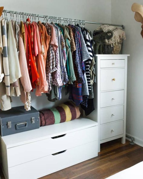 Real Small-Space Closet Solutions: How To Hang Your Clothes Out in the Open Without it Looking Like a Mess | Apartment Therapy Hang Up Clothes With No Closet, Open Closet In Bedroom Small Spaces Organization Ideas, No Closet Solutions Bedroom Kids, Dressers In Closets Small, Clothes Storage With No Closet, Bedroom No Closet Solution, Store Clothes Without Dresser, Small Dresser In Closet, Small Closet Dresser