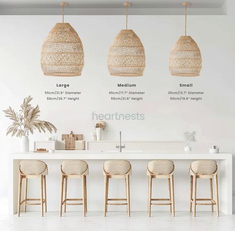 This best-selling bundle has captured the hearts of numerous designers and graced the pages of various interior design magazines. Containing some of the hot-trend wicker lights, this bundle softly disperses light with a gentle ripple effect that mirrors the natural texture of its wicker material. The expansive, undulating design of these wicker baskets ceiling light perfectly complements spaces adorned with neutral, organic, and natural elements, Coastal Kitchen Pendants, Wicker Pendant Light Kitchen, Wicker Lights, Wicker Pendant Lights, Pebble Kitchen, Scandinavian Farmhouse Style, Ibiza House, Scandinavian Coastal, Chairs For Kitchen Island