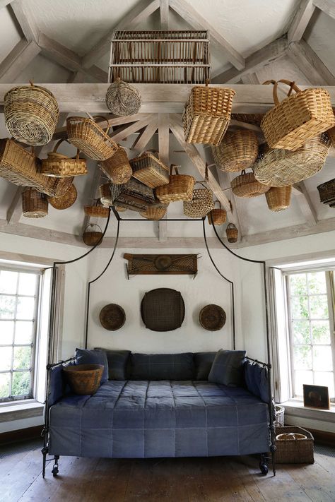 Single-object decorating is always effective, especially in Mrs. Mellon’s houses. A French steel-campaign tester bed, shown here with baskets hanging from the ceiling, was in Oak Spring Farm, and is for sale. Photo: Courtesy of Sotheby’s Bunny Mellon, Basket Lighting, The Ceiling, Ceiling Decor, Basket Decoration, Wicker Baskets, Valance Curtains, Kos, Interior Architecture