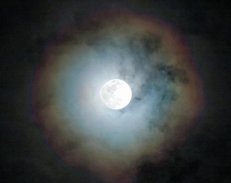 A circular rainbow around the Moon, also known as a Moonbow, lunar halo, or lunar rainbow, is sometimes caused by the refraction of light through ice particles in high altitude clouds.  It generally means rain or snow will fall shortly.  In a number of cases it's actually Cloud, Rainbow, and sometim Mirror Spell, Moon Close Up, Lunar Halo, Rainbow Meaning, Circle Rainbow, Moon Meaning, Moon Rainbow, Refraction Of Light, Moon Clouds