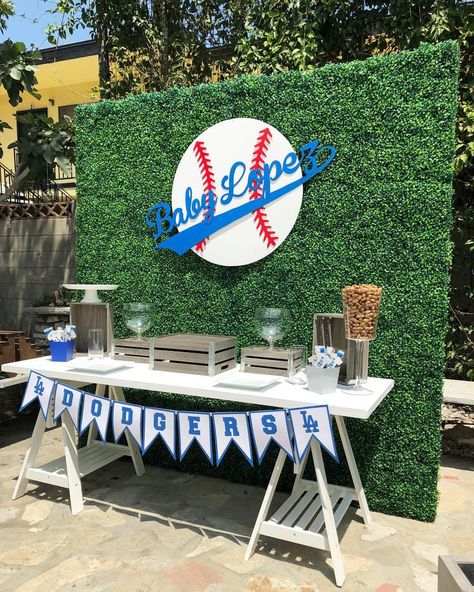 Dodger Baby Shower! Backdrop, base ball sign and table by @bizziebeecreations table decor provided by our client and display by @bizziebeecreations. Wood sign cut by @wolfelaserengraving and banner It’s to hot to put out the desserts and candy. #babyshower #backdrop #dodgers #dodgerbabyshower #catchmyparty #partytime #eventstylist #bizziebeecreations #partydecor #baseballbabyshower #baseballparty #decor #props #events #partyplanner #partyideas #partystyling #eventstylist #eventdecor #party #... Dodgers Baby Shower Ideas, Dodgers Birthday Party, Dodgers Party, Baseball Theme Birthday, Baseball Baby Shower Theme, Sports Baby Shower, Baby Shower Dessert Table, Baseball Theme Party, Baby Backdrop