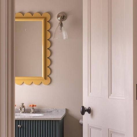 Emma Milne on Instagram: "Looking through from our clients little boys bedroom to their ensuite. We love this little bathroom! It feels calm and elegant, whilst still being fun and fresh. Reeded doors on the vanity, scallops to the @reidandwright mirror, and the pop of tangerine from the taps ensure the scheme is playful. Interiors @emmamilneinteriors Photograph @hana.snow Architecture @deroseesa Construction @clarksonbuildersltd Joinery @clarksoncabinetry #chequerboardfloor #scallopmirror #thewatermonopoly #childrensbathroom #familybathroom #emmamilneinteriors" Fun Kids Bathroom Mirror, Snow Architecture, Fun Kids Bathroom, Little Boys Bedroom, Little Bathroom, Scalloped Mirror, Childrens Bathroom, Fabric Blinds, Bathroom Countertops