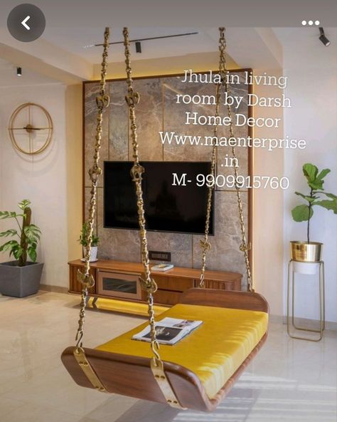 Ceiling Hanging Wooden Swing plank design. This is Plain swing with curved edges. This is traditional indian jhula for home living room.Contact 9909915760 for designs of indian Zula for home. This Wooden jhoola can be hanged in balcony also. We have a wide range of contemporary Swings for living room decor and also modern Swing for luxury homes. If you have a bungalow or Flat we have swing designs for all occasions. Our zulas are made from the best quality teak wood. We have pure brass chains... Wooden Swings In Balcony, Jhoola In Living Room, Jhula In Balcony, Swing In Living Room, Balcony Swing, Living Room Indian, Indian Theme, Wooden Swing, Dressing Table Design