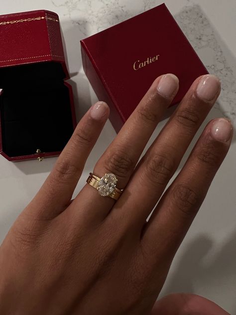 Wedding Rings With Cartier Band, Red Nails Bride Wedding, Cartier Ring With Wedding Ring, Cartier Wedding Band With Oval Ring, Cartier With Engagement Ring, Ring With Cartier Band, Cartier Ring Stacked With Engagement Ring, Oval Ring With Cartier Band, Oval Engagement Ring With Cartier Wedding Band