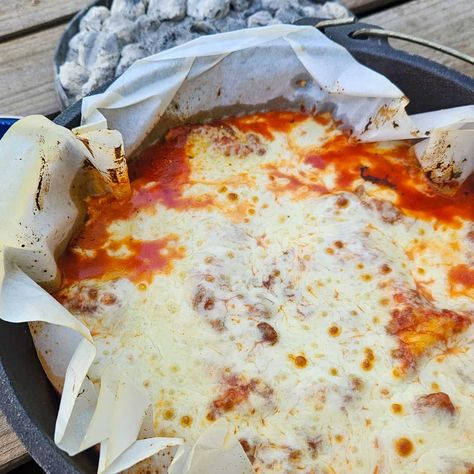 Campfire lasagna that is filled with layers of cheese, sauce and no-cook noodles. Easy camping dinner that can be prepped before your trip. Camping Lasagna, Campfire Lasagna, Camping Recipes Dinner, Dutch Oven Lasagna, Easy Camping Dinners, Dutch Oven Recipes Cast Iron, Batch Cooking Recipes, Pie Iron Recipes, Camping Dinner