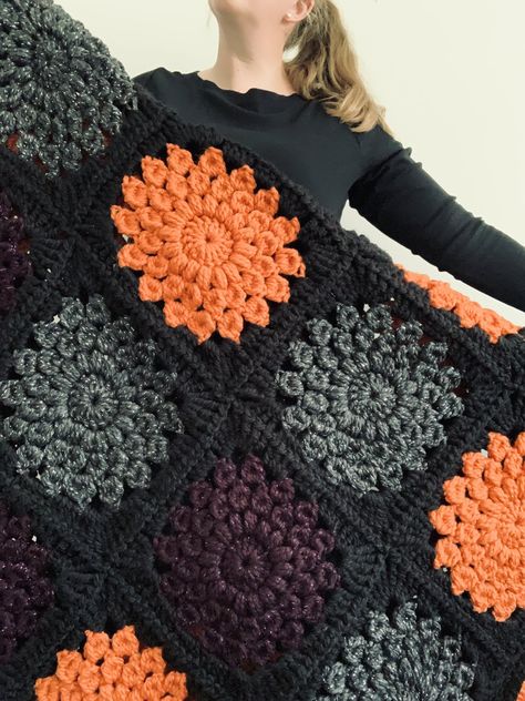 Fall Inspired Crochet Blanket, Quick Granny Square Crochet Blanket, Fall Colours Crochet Blanket, Goth Crochet Blanket Patterns Free, Super Chunky Granny Square Blanket, Halloween Themed Crochet Blankets, Pokeball Granny Square, Crochet Fall Blankets, Crochet Sunburst Granny Square Pattern