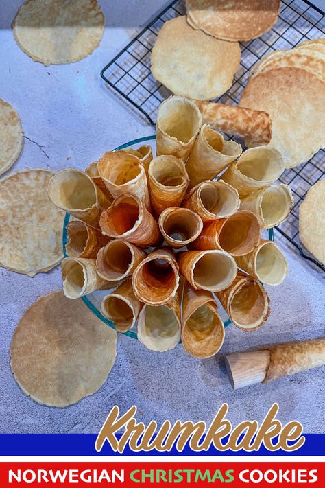 krumkake in a bowl with more around the bowl Krumkake Recipe Norwegian Christmas, Norwegian Krumkake Recipe, Norwegian Lefse, Norwegian Christmas Cookies, Norwegian Krumkake, Norwegian Traditions, Assyrian Recipes, Office Party Foods, Krumkake Recipe