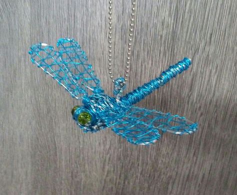 Blue wire dragonfly.  Made from 22 gauge wires. Wire Jewelry Dragonfly, Wire Bugs, Dragonfly Wire Sculpture, Wire And Bead Insects, Insect Wire Sculpture, Wire Sculpture, Turquoise Necklace, Turquoise, Sculpture