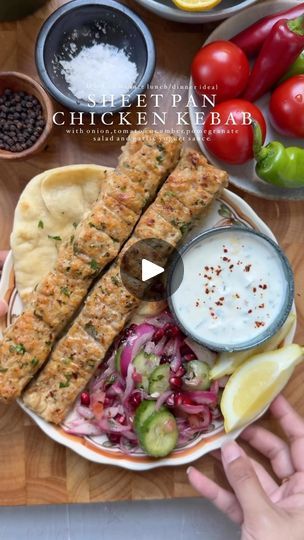 201K views · 18K reactions | Sheet Pan Chicken Kebab with Onion, Tomato, Cucumber Pomegranate Salad and Garlic Yogurt Sauce

Minced Chicken Kebab:

Ingredients:

- 2 lbs boneless, skinless chicken thighs, minced
- 1 large red onion, finely chopped and squeezed
- 1-2 jalapeños, finely chopped
- 8-9 cloves fresh garlic, minced
- 1 tbsp freshly minced parsley
- 2 tbsp tomato paste
- Salt, to taste
- 1 tsp black pepper
- 1 tbsp garlic powder
- 1 tbsp onion powder
- 1 tsp ground cumin
- 1 tsp red chili flakes
- 3 tbsp oil

For the Onion, Tomato, Pomegranate Salad:

Ingredients:

- 1 cucumber, sliced
- 1 red onion, sliced
- 1 large tomato, seeded and finely chopped
- 1/2 cup pomegranate seeds
- 1 tbsp freshly chopped parsley
- Salt, to taste
- 1 tsp sumac
- 1 tsp lemon juice
- 2 tbsp olive oil Sheet Pan Chicken Kebab, Garlic Yogurt Sauce, Chicken Kabab, Garlic Yogurt, Chicken Kebab Recipe, Minced Chicken, Chicken Kebab, Sheet Pan Chicken, Pomegranate Salad