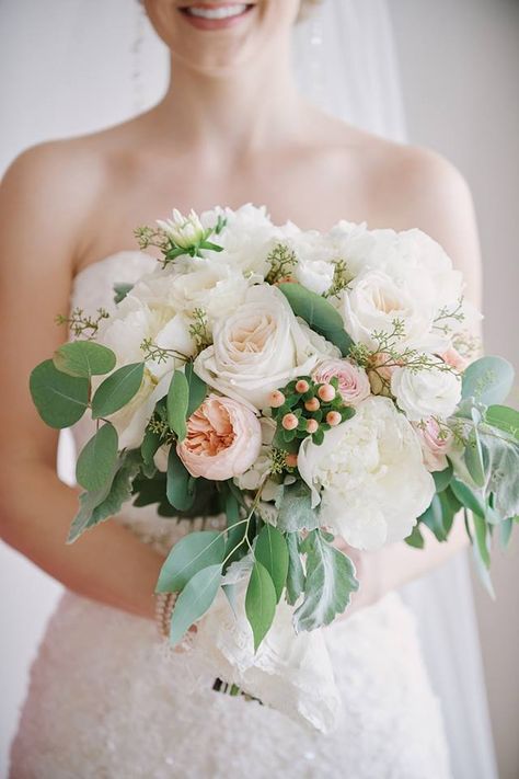 Soft and sweet wedding bouquet in white, ivory, light blush and peach tones.  Peonies, garden roses, ranunculus, hypericum berry and other seasonal blooms are complimented with eucalyptus.  Perfect elegant and classic bouquet designed by Bella Flora 30a. White Blush Peach Wedding Flowers, White And Peach Rose Bouquet, Peach And Cream Bridal Bouquet, Bride Bouquet Pink, Peach White Green Bouquet, Salmon Wedding, Peach Color Schemes, Peach Pink Cream Bouquet, Hypericum Berry