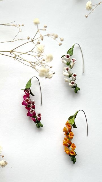 Marline | Polymer Clay Florist & Metalsmithing on Instagram: "Foxgloves earrings for the August collection. They’ll be in 3 different colors  . . . . . #foxglove #art #miniature #miniatureflowers #polymerclay #artistsoninstagram #clayflower #wireearrings #slowmadejewelry #polymerclayjewelry" Unique Flower Polymer Clay Earrings, Polymer Clay Wildflowers, Cheap Flower-shaped Polymer Clay Jewelry, Unique Flower-shaped Polymer Clay Earrings, Whimsical Flower-shaped Polymer Clay Jewelry, Polymer Clay Flower Jewelry, Wire Earrings, Flower Jewellery, Polymer Clay Jewelry