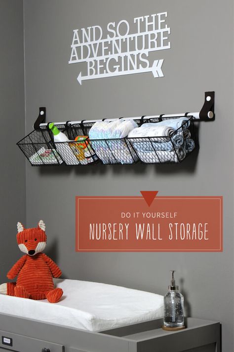 Nursery wall storage solution for above baby changing table made from a dowel rod and leather straps. Baskets make it easy to store diapers and baby supplies so they are easy to grab. Nursery Wall Storage, Vogue Kids, Changing Tables, Baby Room Organization, Baby Storage, Baby Changing Table, Church Nursery, Ideas Hogar, Nursery Storage