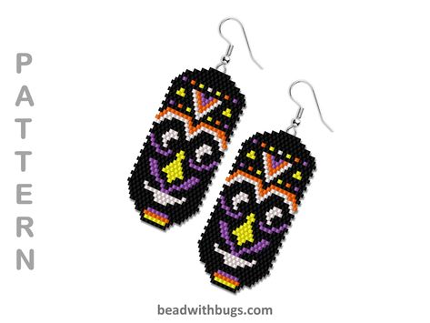 ETHNIC MASK.  These brick stitch earrings finish at 2.4 inches long and 1.2 inches wide.  A lovely colour change would be to substitute the purple for turquoise or red!   Stitch Type: Brick Bead Type: Miyuki Delica Bead Size: 11/0 Finished Size: 1.2 x 2.4 PDF file includes: Bead Legend Bead Graph Additional Information: All of my patterns are for personal use and you are free to sell your finished product. Please do not reproduce, share or sell this pattern. Beaded Earrings Pattern, Diy Seed Bead Earrings, Stitch Earrings, Earrings Pattern, Winter Earrings, Brick Stitch Earrings, Christmas Tree Earrings, Beaded Earrings Patterns, Earring Tree