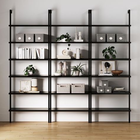 Width: 30 inches Height: 85 inches Length: 11.7 inches Meet Theo, the perfect blend of industrial cool and farmhouse charm for your home. With its sleek black finish, this bookshelf effortlessly blends into any space. Whether you want to use a single unit or mix and match multiple shelves to create a jaw-dropping wall unit, Theo brings you plenty of storage for all your favorite books and decor. Crafted with a sturdy metal frame and modern engineered wood, these shelves can handle up to 50 lbs. Bookshelf Table, Office Diy, Designer Office, Dresser With Tv, Nathan James, Wall Mounted Bookshelves, Ladder Bookshelf, Living Room Furniture Arrangement, Shelf Wood