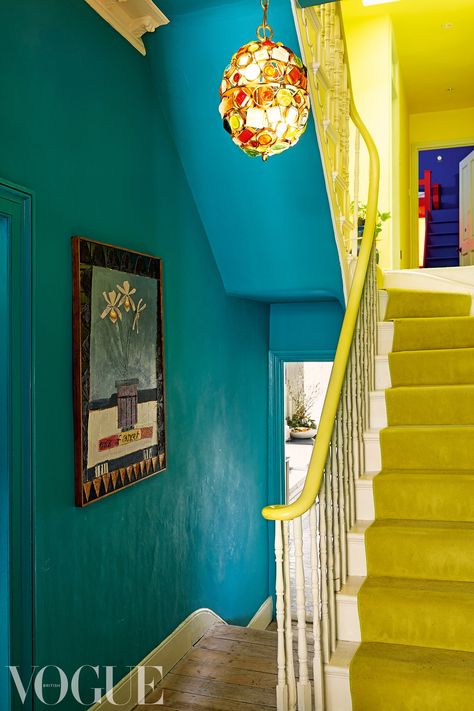 Yellow And Blue Hallway, Colorful Stairwell, Leopard Stairs, Bright Hallways, Blue Hallways, Bright Staircase, Paint Hallway, Yasmin Sewell, Bright Hallway