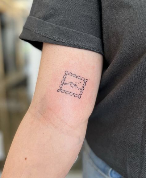 Minimal, fine line mountain postage stamp tattoo. #tattoo #mountaintattoo #finelinetattoo #tattooidea #sticker #patchwork Small Tattoos Legs Women, Vintage Post Stamp Tattoo, Utah Stamp Tattoo, Minimal Stamp Tattoo, Desert Stamp Tattoo, Small Fine Line Mountain Tattoo, Minimalist Stamp Tattoo, Mountain Patchwork Tattoo, Post Stamp Tattoo Aesthetic