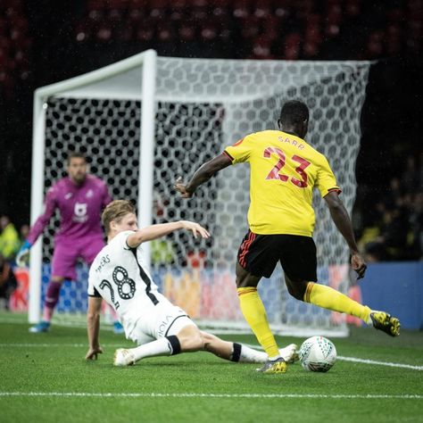 Watford 2 Swansea City 1 in Sept 2019 at Vicarage Road. Ismaila Sarr cuts the ball back with George Byers sliding in to tackle in the League Cup 3rd Round. Tackle Football, Swansea City, The League, Swansea, Soccer Field, Soccer, Football, Road, Collage