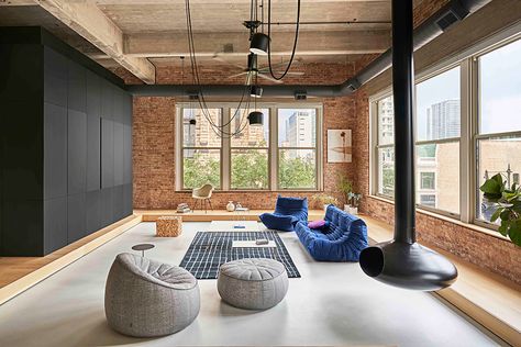 An Old Chicago Factory Loft Is Transformed Into a Homebody's Dream Living Room Zones, Light Wooden Floor, New Staircase, Cosy Living Room, Sleeping Loft, Exposed Brick Walls, Apartment Life, 아파트 인테리어, Urban Lifestyle