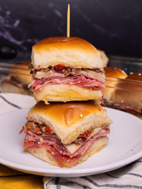 Muffuletta Sliders | 12 Tomatoes Muffaletta Sandwich Sliders, Muffalata Sliders, Mini Muffaletta Sliders, Muffalata Sandwich Recipes, Muffelata Sliders, Muffaletta Sliders, Muffuletta Sliders, Slider Ideas, Easy Sliders