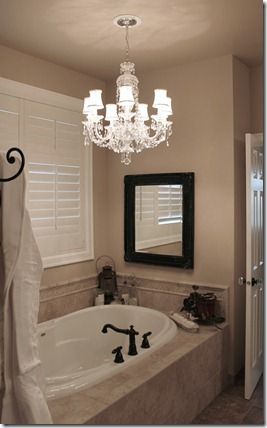 Love this idea, we have a standard recessed light above our tub, I'll definitely be looking for a chandelier type lighting fixture...great idea! Garden Tub Decor, Garden Tub Decorating, Tub Decorating Ideas, Bathtub Surround, Bathtub Decor, Tub Ideas, Tub Surround, Garden Tub, Bathroom Redo