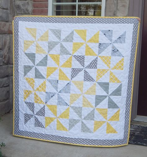 40 x 40 I finished this simple baby quilt this week.  Yellow and Gray is so nice and soothing together, especially for a baby quilt. I cut 2 - 5 inch squares for each pinwheel from each the print and Simple Baby Quilt, Simple Quilting, Baby Boy Quilt Patterns, Pinwheel Quilt Pattern, Girl Quilts Patterns, Boys Quilt Patterns, Baby Quilt Tutorials, Modern Baby Quilt, Yellow Quilts