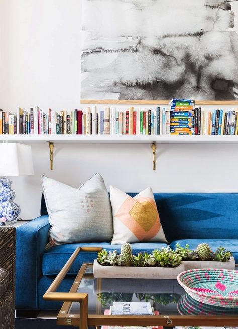 Living room with large art, a wall of books, and a blue velvet sofa Shelves Above Sofa, Amazon Living Room Decor, Amazon Living Room, Shelves Above Couch, Design For Small Spaces, Above Sofa, Chic Loft, Farmhouse Living Room Decor, Floating Bookshelves