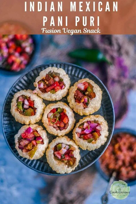 Pani puri recipe gets a Mexican Indian fusion makeover! Here, the puris are filled with Mexican food - beans & salsa to give this vegan Asian snack a whole new flavor! Makes for a crunchy, tasty snack that's loved by all! #panipuri #Mexican #Indian #fusion #vegan #snack #streetfood #howtomake #salsa #beans #plantbased #appetizer Mexican Pani Puri, Fusion Food Ideas, Paani Puri, Indian Starters, Indian Buffet, Mexican Fusion, Pani Puri Recipe, Snack Easy, Puri Recipe