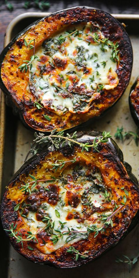 Stuffed Acorn Squash with Creamed Spinach on a baking sheet. Vegetable Stuffed Acorn Squash, Italian Acorn Squash Recipes, Vegtables Dishes Winter, Delish Keto Recipes, Sliced Butternut Squash Recipes, Autumn Gluten Free Recipes, Dinner Recipes Couscous, Christmas Food Dishes, Main Dish Ideas For A Party