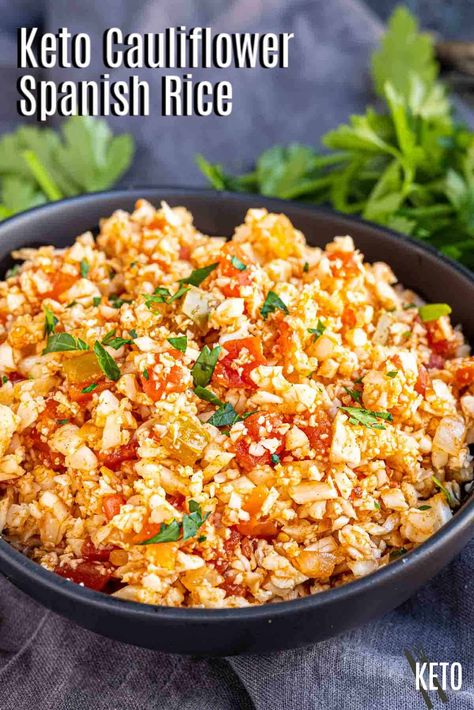 Keto cauliflower Spanish rice is a tasty, low carb alternative to the traditional dish. You can make this flavor packed dish quickly to serve it alongside your favorite Mexican inspired entrees. Make this simple Mexican cauliflower rice in 10 minutes and serve with your favorite low carb Tex-Mex dinner recipes. This easy cauliflower rice recipe is the perfect addition to any keto meal. Cauliflower Spanish Rice, Keto Rice, Spanish Cauliflower Rice, Mexican Cauliflower Rice, Mexican Cauliflower, Ketosis Diet Recipes, Low Carb Side Dish, Cauliflower Rice Recipe, Low Carb Side