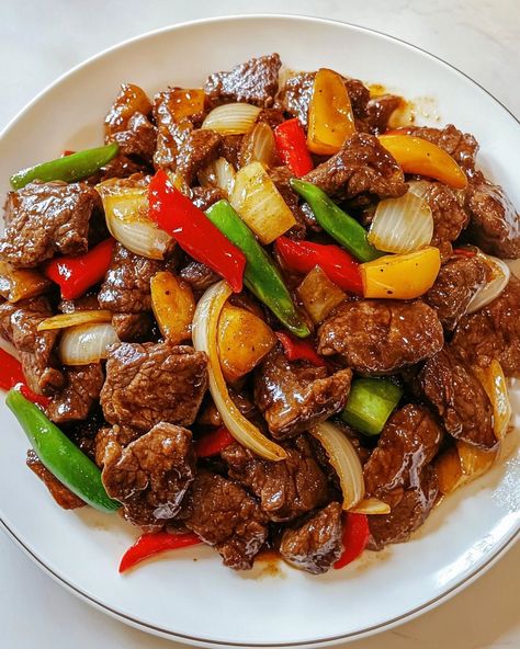 Bring the vibrant flavors of Chinese cuisine to your kitchen with our Chinese-Style Beef and Onion Stir-Fry Recipe. This quick and easy recipe combines tender strips of beef with crisp, savory onions in a rich, flavorful sauce that's sure to satisfy your taste buds. Perfect for busy weeknights or a delicious weekend meal, this beef and onion stir-fry offers a delightful blend of umami and spice that mirrors your favorite takeout dishes. The recipe is designed for simplicity and speed, making it Steak Stirfry Recipes, Pork Stir Fry, Chinese Cooking Recipes, Pepper Steak, Spicy Pork, Chinese Cooking, Stir Fry Recipes, Asian Dishes, Best Recipe