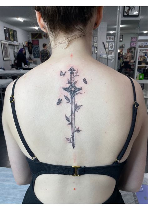 A feminine sword tattoo along the spine, in fine line black and grey for women girls delicate Butterfly Swords, Flower Spine Tattoos, Tattoo Butterfly, Spine Tattoos For Women, Spine Tattoo, Henna Tattoos, Tattoo Art Drawings, Spine Tattoos, Fine Line