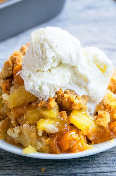 The best quick and easy peach dump cake recipe (peach cobbler dump cake), homemade with simple ingredients. A great Summer dessert, made with 3 ingredients and starts off with a yellow cake mix! This is one of the easiest desserts you can make, especially when you are short on time. You just dump everything in a cake pan and just bake. I am not sure why they refer to it as a cake because but I really feel it has the texture of a cobbler more than a cake. Once everything is baked, you end up ... Cakes Using Cake Mixes, Cobbler Dump Cake, Peach Cobbler Dump Cake, Mix Salad, Peach Dump Cake, Easy Peach Cobbler Recipe, Cobbler Easy, Dump Cake Recipe, Rectangle Cake