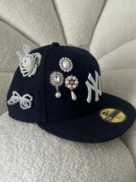 Each charm is hand placed by me. Sports Hats For Women, Bedazzled Fitted Hat, Decorated Baseball Caps, Merch Ideas Products, Custom Hat Ideas, Bedazzled Hat, Nyc Hat, Bling Hats, Yankee Fitted