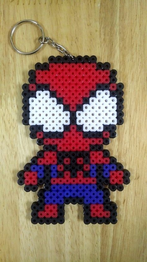 Spiderman perler beads Peeler Bead Spiderman, Superhero Perler Beads, Pyssla Ideas Spiderman, Spiderman Perler Bead Patterns, Perler Bead Patterns Spiderman, Perler Beads Spiderman, Spiderman Beads, Spider Man Perler Beads, Spiderman Perler Beads