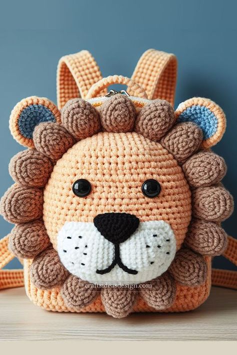 The adorable crochet lion backpack is a delightful creation perfect for any crochet enthusiast. Featuring a warm orange body with a detailed brown mane, this backpack captures the essence of cuteness and playfulness. The large, expressive eyes and the intricate nose and mouth detailing add to the lion's charming appearance. Crochet Backpack Pattern, Crochet Lion, Crochet Backpack, Expressive Eyes, Crochet Pouch, Adorable Crochet, Handbag Pattern, Crochet Animal Patterns, Pink Yarn