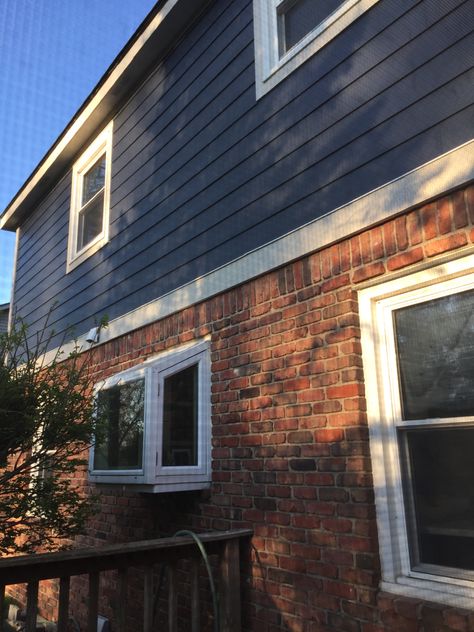 Orange Brick Blue Siding, Grey Blue Brick House Exterior, Brick House With Blue Siding, James Hardie Deep Ocean, Blue Brick House Exterior, Navy Blue Houses, Dark Blue Houses, Outdoor Garage Lights, Red Brick House Exterior