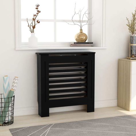 This cover makes a stylish and practical addition to your living room. This cover cabinet is made of MDF, sturdy and durable. It features a modern slatted design, making it suitable for any decor. The shelf provides ample space for placing your books, photo frames, ornaments, etc. Colour: Black Material: MDF Dimensions: 78 x 19 x 81.5 cm (W x D x H) With horizontal slats Assembly required: Yes Black Radiator Cover, Vertical Slats Wall, Black Radiator, Heating Radiator, Metal Storage Cabinets, Books Photo, Radiator Cover, Slat Wall, Side Cabinet