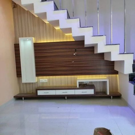 Under Stair Decoration Ideas ✨️| Stair Design Ideas ✨️ #railing #understairs #stairs #understairstorage #stairdesign #stairdesigns #glassrailing #understairsstorage #homedesignsdworld #explorepost #explorepage #reeelitfeelit #trendingdesigns #railingdesign #budget2024 #yogawithwall #celebritystylist #bhindifry #rafaelnadal Staircase Down Tv Unit, Duplex Steps Wall Design, Tv Below Staircase, Tv Unit Under Staircase Living Rooms, Tv Under Stairs Living Room, Rafters Design, Tv Unit Under Staircase, Design Under Stairs Ideas, Stairs Tv Unit