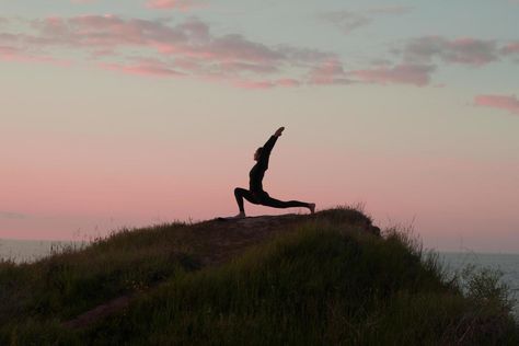 Fit woman doing yoga stretching exercise outdoor in beautiful mountains landscape. Female on the rock with sea and sunrise or sunset background training asans. Silhouette of woman in yoga poses Australia Moodboard, Yoga Sunset, Silhouette Of Woman, Woman Doing Yoga, Stretching Exercise, Yoga Stretching, Fit Woman, Mountains Landscape, Sunset Background