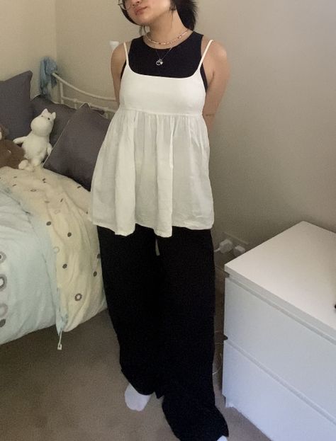 Black tank top and black wide leg formal trousers layered on top with a white baby doll top spring autumn summer outfit Doll Top Outfit, Baby Doll Top Outfit, Black Tank Outfit, Baby Doll Top, Tank Outfit, Formal Trousers, Black Tank Top, Spring Tops, Babydoll Top